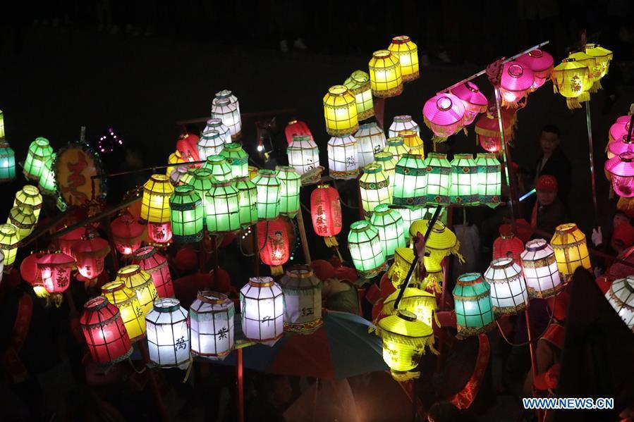 People holding colorful lanterns take part in the celebration of Huodeng Festival in Jiepai Town of Hengyang County, central China\'s Hunan Province, March 13, 2019. The Huodeng Festival was held here to wish for good luck in the new year. (Xinhua/Liu Xinrong)
