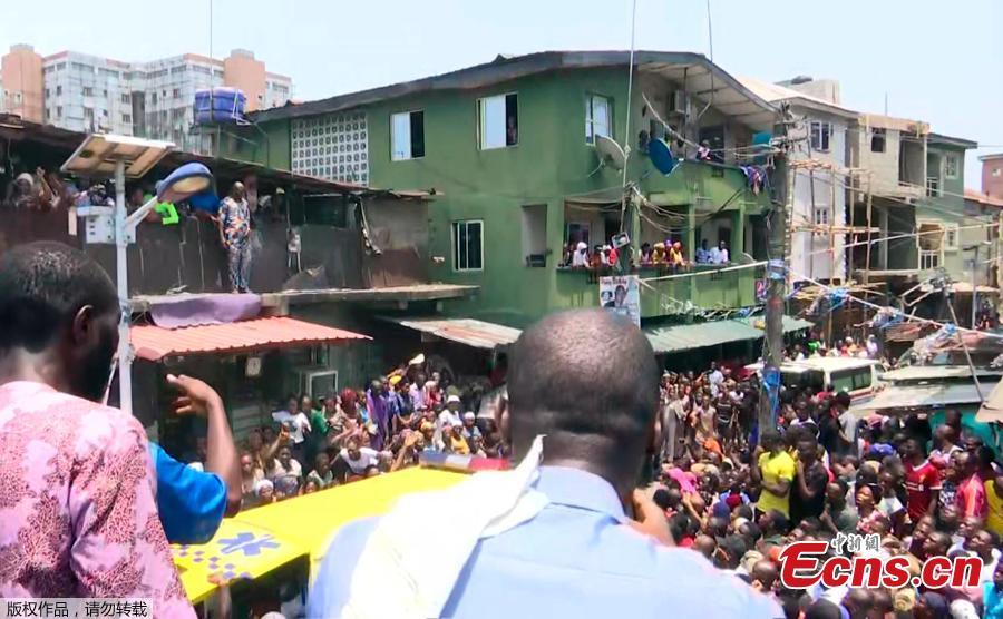 Rescue workers search for survivors at the site of a collapsed building containing a school in Nigeria\'s commercial capital Lagos, Nigeria, March 13, 2019. As many as 100 children and many others were feared trapped on Wednesday after the building collapsed. (Photo/Agencies)