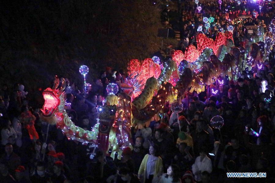 People holding colorful lanterns take part in the celebration of Huodeng Festival in Jiepai Town of Hengyang County, central China\'s Hunan Province, March 13, 2019. The Huodeng Festival was held here to wish for good luck in the new year. (Xinhua/Liu Xinrong)