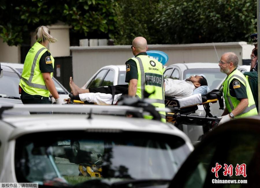 Ambulance staff take a man from outside a mosque in central Christchurch, New Zealand, Friday, March 15, 2019.  At least 40 people were killed in multiple shootings in the two mosques of New Zealand\'s Christchurch on Friday afternoon, and police said they have arrested four suspects so far.  (Photo/Agencies)