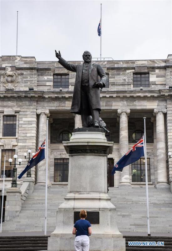 A New Zealand\'s national flag flies at half-mast in front of the parliament buildings in Wellington, capital of New Zealand, on March 16, 2019. Gunmen opened fire in two separate mosques in Christchurch on Friday, killing 49 people and wounding 48 others. (Xinhua/Guo Lei)