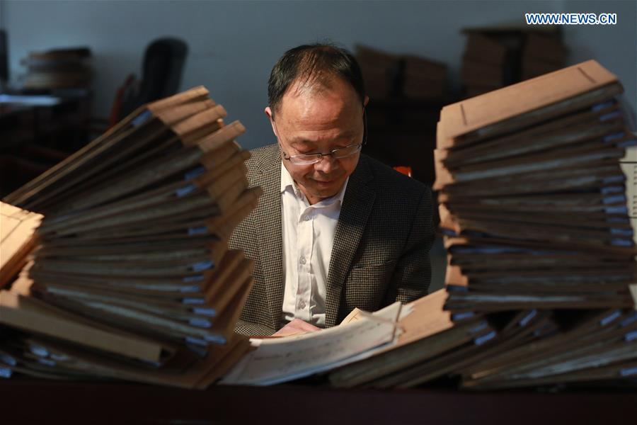 Wang Zongxun, curator of a museum of Jinping Writs, reviews archives of the documents at the museum in Jinping County, southwest China\'s Guizhou Province, March 18, 2019. Dating back to the Ming Dynasty (1368-1644), \