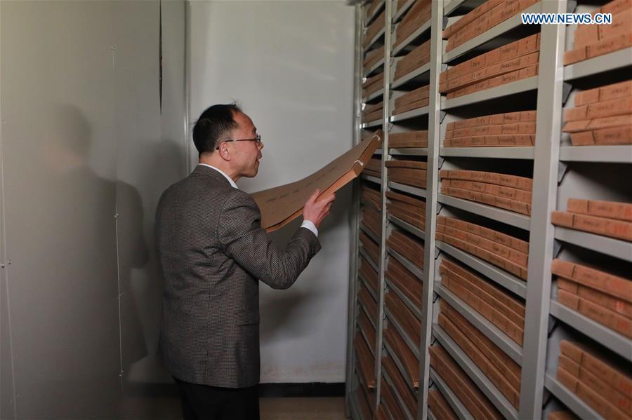Wang Zongxun, curator of a museum of Jinping Writs, files archives of the documents at the museum in Jinping County, southwest China\'s Guizhou Province, March 18, 2019. Dating back to the Ming Dynasty (1368-1644), \