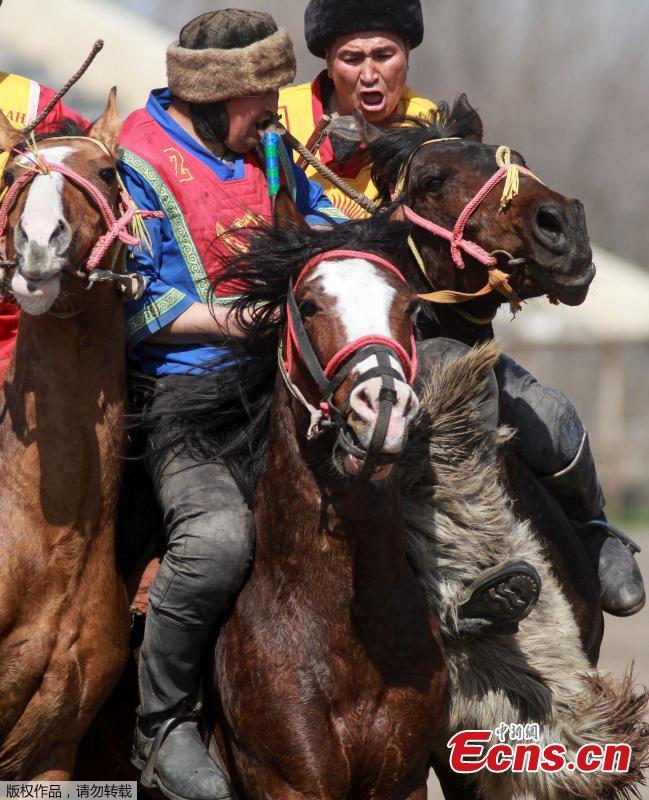 Horsemen take part in a Kok-boru, or goat dragging competition as part of Navruz celebrations, an ancient holiday marking the spring equinox, in Bishkek, Kyrgyzstan, March 18, 2019. (Photo/Agencies)