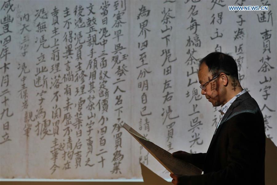Wang Zongxun, curator of a museum of Jinping Writs, displays a digitalized document at the museum in Jinping County, southwest China\'s Guizhou Province, March 18, 2019. Dating back to the Ming Dynasty (1368-1644), \