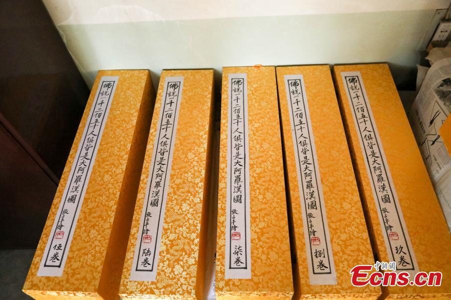 The 66-year-old farmer, also a local folk artist specializing in the making and painting of Buddhist sculptures, said he spent eight years creating nine scrolls, each weighing five kilograms and measuring 69 centimetres in width. The total length of the scrolls measured more than 300 meters. He also said he had attempted to apply for a Guinness World Record. (Photo: China News Service/Wang Bintian)