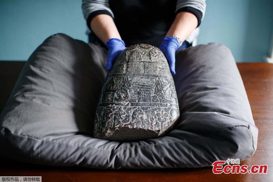 Photo taken on March 19, 2019 shows the ancient Babylonian treasure in British Museum.  The Babylonian treasure is being returned to Iraq after it was taken from the country illegally. The cuneiform kudurru, an official document drawn up on the orders of a Babylonian king, was seized at Heathrow airport in 2012.  The stone dates from the reign of King Nebuchadnezzar I (about 1126-1103BC).