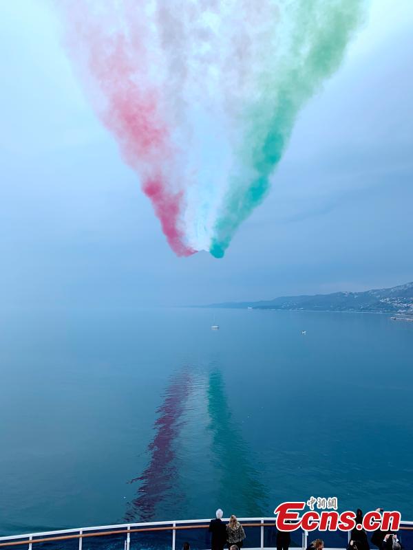 The aerobatic demonstration team Frecce Tricolori performs as part of celebrations for the naming of Costa Venezia, the first Costa ship built specifically for the Chinese market, in Trieste, Italy, March 1, 2019. (Photo: China News Service/Peng Dawei)