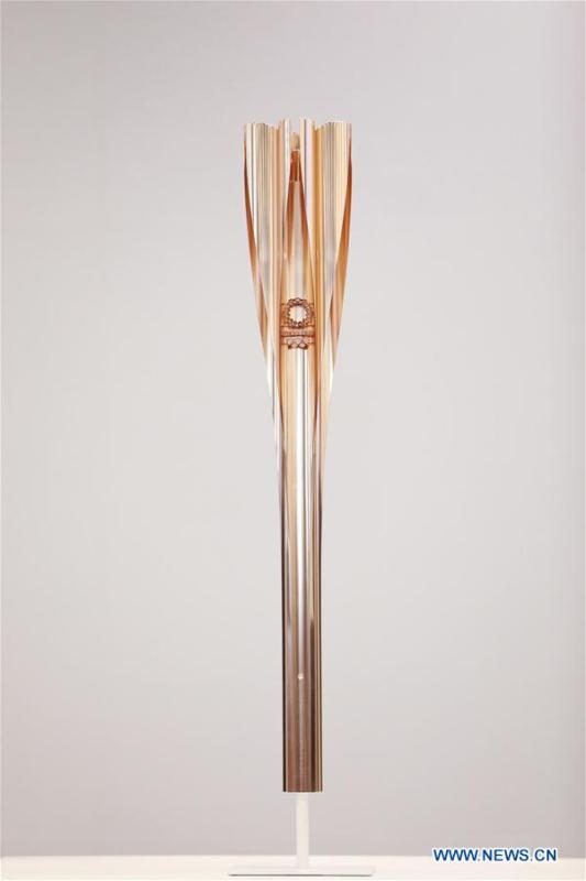 Photo taken on March 20, 2019 shows the prototype of the Tokyo 2020 Olympic Torch. Tokyo 2020 unveiled the prototype of the Tokyo 2020 Olympic Torch on Wednesday. The motif of Tokyo 2020 Olympic Torch is cherry blossom. Aluminum recycled from temporary housing used in areas struck by the Great East Japan Earthquake disaster will be used to manufacture the torch. (Xinhua/Du Xiaoyi)