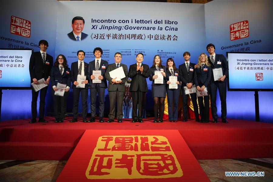 Jiang Jianguo (C), deputy head of the Publicity Department of the Communist Party of China Central Committee, and Paolo M. Reale (5th, L), president of Rome Convitto Nazionale Vittorio Emanuele II, an Italian boarding school, pose for a photo with Italian sutdents at a seminar on \