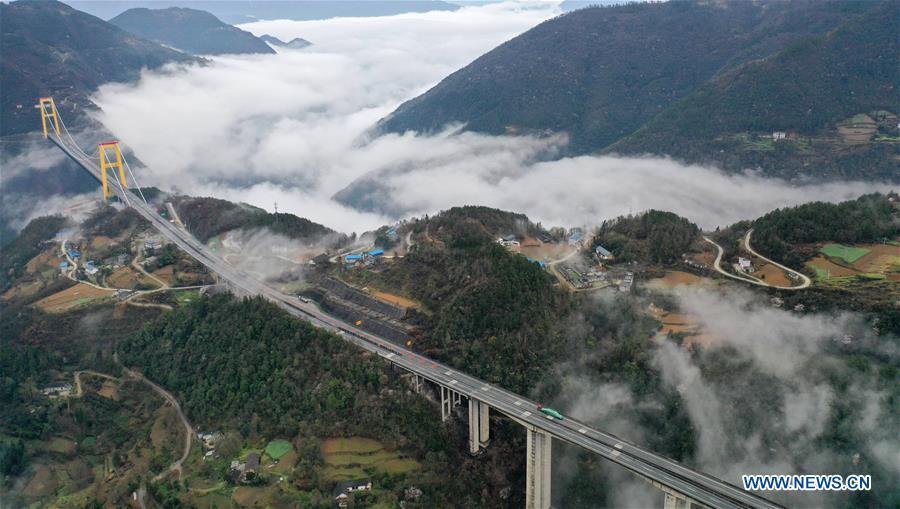 This aerial photo taken on March 23, 2019 shows the Siduhe Bridge on the Shanghai-Chongqing Highway in Yesanguan Town of Badong County in Enshi Tujia and Miao Autonomous Prefecture, central China\'s Hubei Province. The Siduhe Bridge, built 90 meters high and 560 meters up from the valley bottom, forms a landscape in Enshi. (Xinhua/Yang Shunpi)