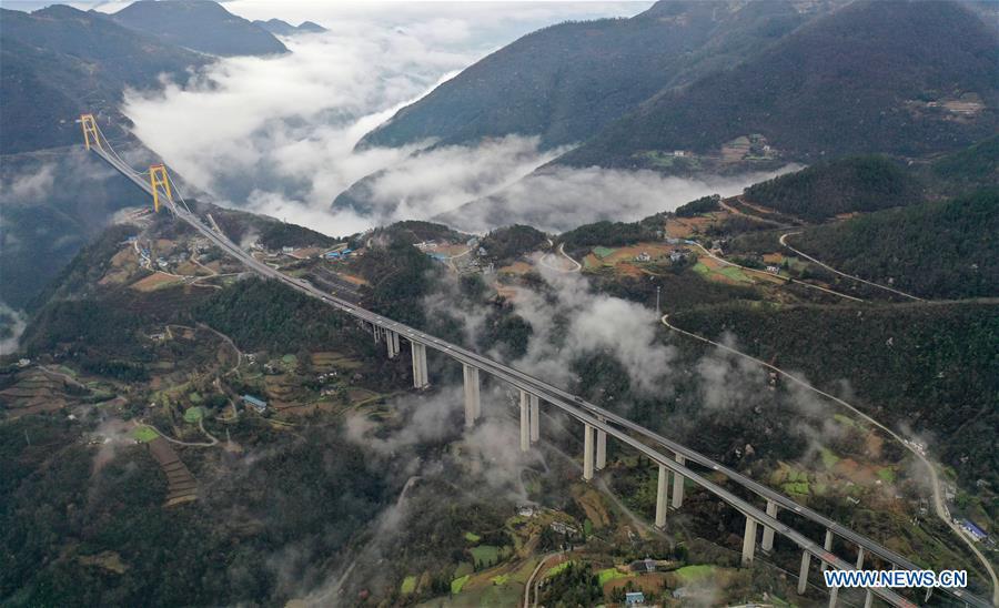 This aerial photo taken on March 23, 2019 shows the Siduhe Bridge on the Shanghai-Chongqing Highway in Yesanguan Town of Badong County in Enshi Tujia and Miao Autonomous Prefecture, central China\'s Hubei Province. The Siduhe Bridge, built 90 meters high and 560 meters up from the valley bottom, forms a landscape in Enshi. (Xinhua/Yang Shunpi)