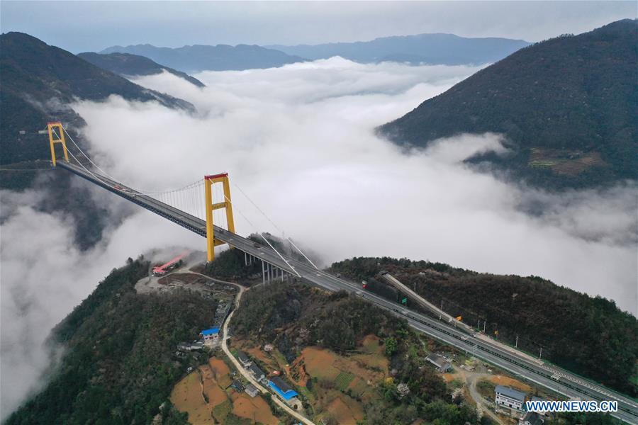 This aerial photo taken on March 23, 2019 shows the Siduhe Bridge on the Shanghai-Chongqing Highway in Yesanguan Town of Badong County in Enshi Tujia and Miao Autonomous Prefecture, central China\'s Hubei Province. The Siduhe Bridge, built 90 meters high and 560 meters up from the valley bottom, forms a landscape in Enshi. (Xinhua/Yang Shunpi)