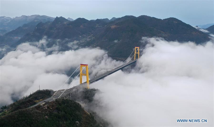 This aerial photo taken on March 23, 2019 shows the Siduhe Bridge on the Shanghai-Chongqing Highway in Yesanguan Town of Badong County in Enshi Tujia and Miao Autonomous Prefecture, central China\'s Hubei Province. The Siduhe Bridge, built 90 meters high and 560 meters up from the valley bottom, forms a landscape in Enshi. (Xinhua/Yang Shunpi)