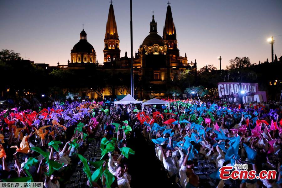 1,486 people hold a tequila tasting at the Plaza Liberacion in Guadalajara, Jalisco, Mexico, on March 24, 2019 in an attempt to set a new Guinness World Record for the \