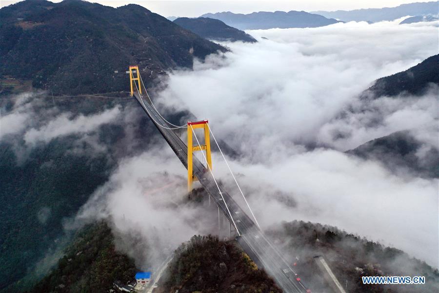 This aerial photo taken on March 23, 2019 shows the Siduhe Bridge on the Shanghai-Chongqing Highway in Yesanguan Town of Badong County in Enshi Tujia and Miao Autonomous Prefecture, central China\'s Hubei Province. The Siduhe Bridge, built 90 meters high and 560 meters up from the valley bottom, forms a landscape in Enshi. (Xinhua/Yang Shunpi)