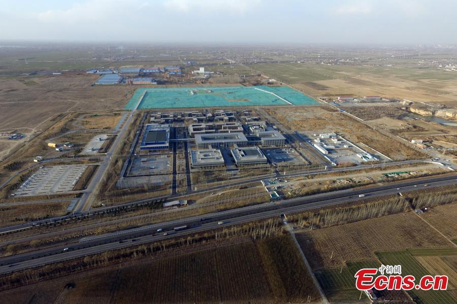A public services center is the first construction project in Xiongan New Area since the new economic zone was established in 2017. In April 2017, China announced the establishment of the Xiongan New Area, spanning three counties in Hebei Province about 100 km southwest of Beijing. Many of Beijing\'s non-capital functions, as well as some of its population, will be relocated to Xiongan. (Photo: China News Service/Han Bing)