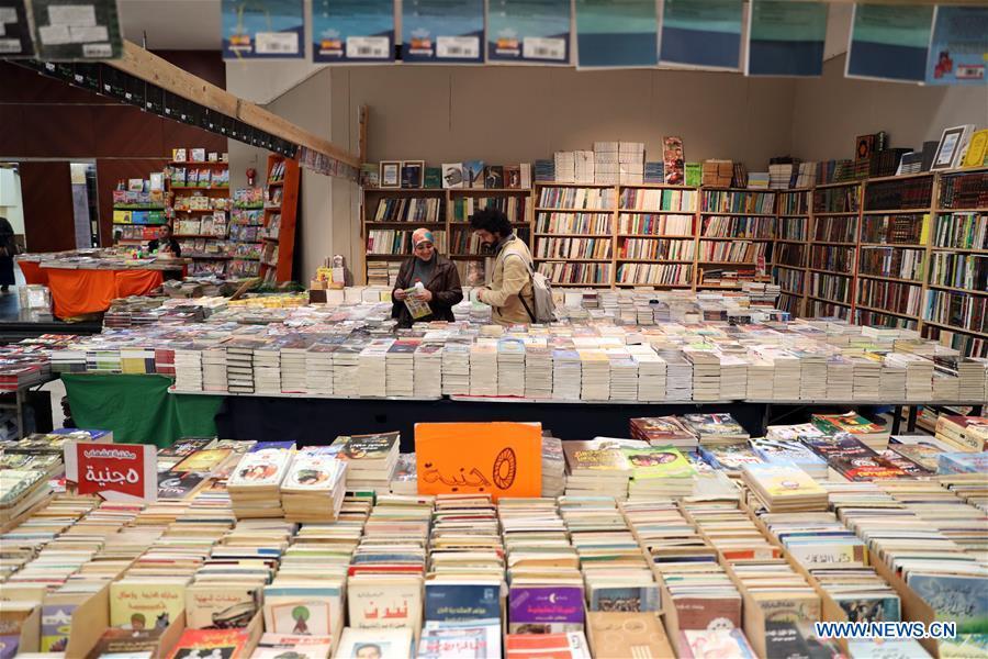 People visit the Alexandria International Book Fair in Alexandria, Egypt, March 31, 2019. The 15th Alexandria International Book Fair, the second largest exhibition in Egypt, witnessed a high visitor turnout, surprising officials of Bibliotheca Alexandria, the organizing body of the two-week event. (Xinhua/Ahmed Gomaa)