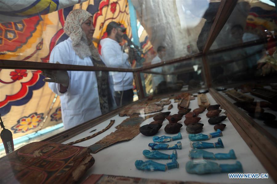 Photo taken on April 5, 2019 shows the antiquities discovered in a tomb in Sohag, Egypt. The Egyptian Minister of Antiquities announced on Friday the discovery of a tomb, dating back to the Ptolemaic era which spans from 305 BC to 30 BC, in Sohag province south of the capital Cairo. (Xinhua/Ahmed Gomaa)