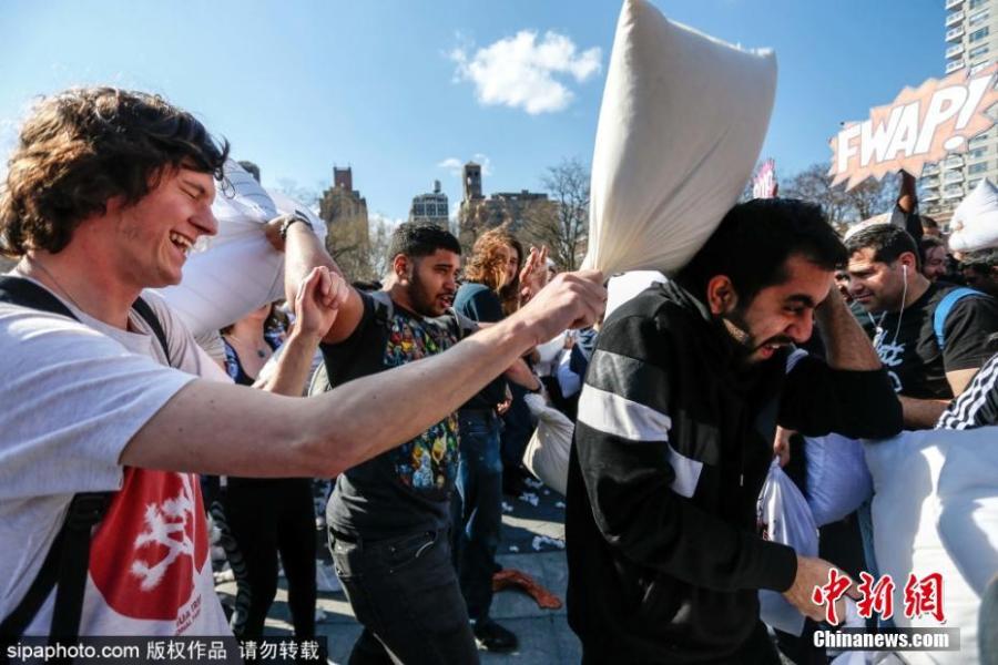 Participants take part in New York City\'s annual Pillow Fight Day in Washington Square Park on April 6, 2019. People engaged in friendly battle with each other during the event. (Photo/SipaPhoto)