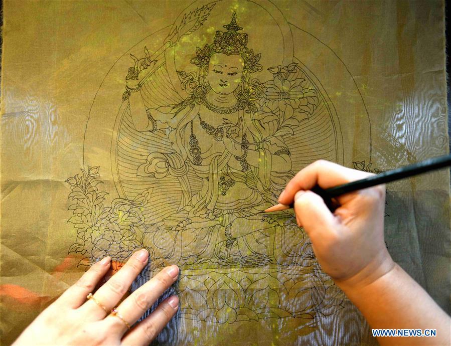Craftswoman Liu Yuxia creates an embroidery work at her studio in Qiaoxi District of Shijiazhuang, north China\'s Hebei Province, April 4, 2019. Liu Yuxia is an inheritor of Xu embroidery, which was listed as one of Shijiazhuang\'s intangible cultural heritages in 2018. Based on traditional Chinese embroidery skills, her works of unique style present the integration of Chinese and western painting techniques and photography. (Xinhua/Chen Qibao)