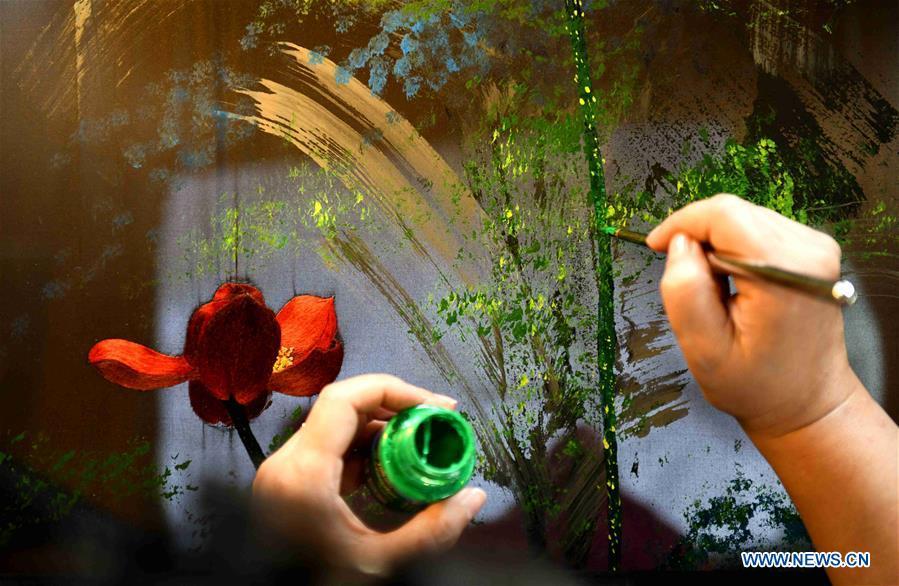 Craftswoman Liu Yuxia creates an embroidery work at her studio in Qiaoxi District of Shijiazhuang, north China\'s Hebei Province, April 4, 2019. Liu Yuxia is an inheritor of Xu embroidery, which was listed as one of Shijiazhuang\'s intangible cultural heritages in 2018. Based on traditional Chinese embroidery skills, her works of unique style present the integration of Chinese and western painting techniques and photography. (Xinhua/Chen Qibao)