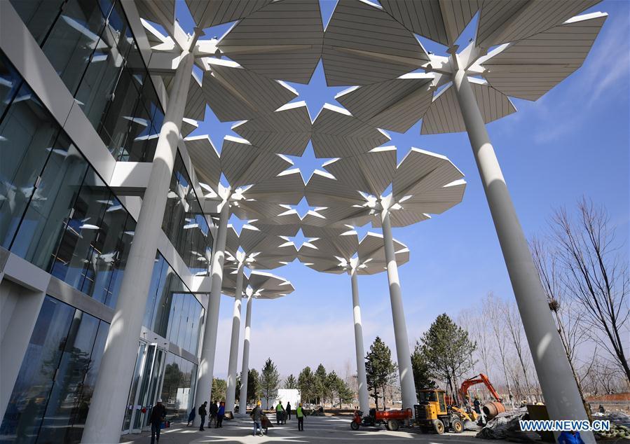 Photo taken on March 26, 2019 shows the International Pavilion being arranged at the site of the International Horticultural Exhibition 2019 Beijing China in Yanqing district of Beijing, capital of China. (Photo/Xinhua)
International Pavilion

Indoor exhibitions and plant competitions will unfold at the International Pavilion. Blossoms are weaved into 94 umbrellas to create a sea of flowers. This floral ocean opens up as an enormous sunshade, shielding the area from the summer heat to provide a pleasant recreational area. When evening falls, it lights up and transforms into a spectacular night view of colors.