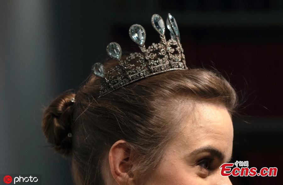 A model wears a rare aquamarine and diamond tiara by Faberge, at Christie\'s auction rooms in London, Tuesday, April 9, 2019. The tiara estimated at 230,000-340,000 US dollars will be sold at the Geneva Magnificent Jewels auction on May 15. (Photo/IC)