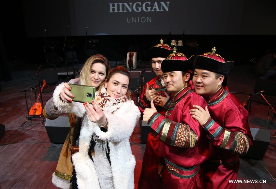 Serbian audiences take selfies with members of the Hinggan Primitive Music Ensemble from China\'s Inner Mongolia after the performance in Belgrade, capital of Serbia, Feb. 16, 2019. Hundreds of local visitors enjoyed the performance which was part of the \