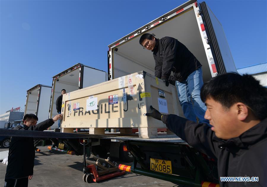 Logistics staff load Chinese cultural relics transported from Italy, which have been cleared by the customs, into trucks, at Beijing International Airport in Beijing, capital of China, April 10, 2019. A total of 796 Chinese cultural relics arrived at Beijing International Airport at 6:54 a.m. Wednesday after an eight-hour flight from Italy. The group of Chinese artifacts were first noticed by a unit of Carabinieri, or the national gendarmerie of Italy, on the local relics auction market in 2007, which was followed by a domestic judicial trial. (Xinhua/Li He)