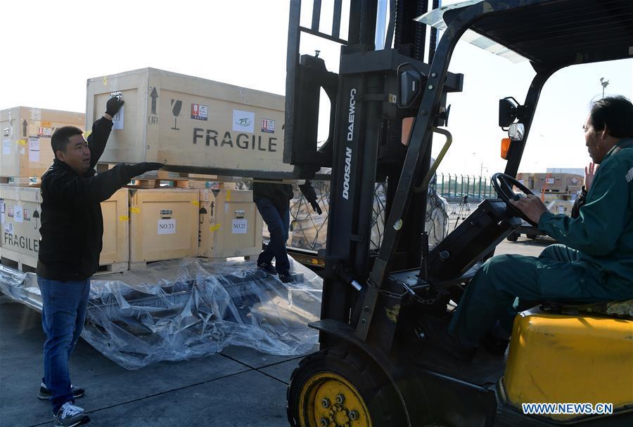 Logistics staff load Chinese cultural relics transported from Italy, which have been cleared by the customs, into vehicles, at Beijing International Airport in Beijing, capital of China, April 10, 2019. A total of 796 Chinese cultural relics arrived at Beijing International Airport at 6:54 a.m. Wednesday after an eight-hour flight from Italy. The group of Chinese artifacts were first noticed by a unit of Carabinieri, or the national gendarmerie of Italy, on the local relics auction market in 2007, which was followed by a domestic judicial trial. (Xinhua/Li He)