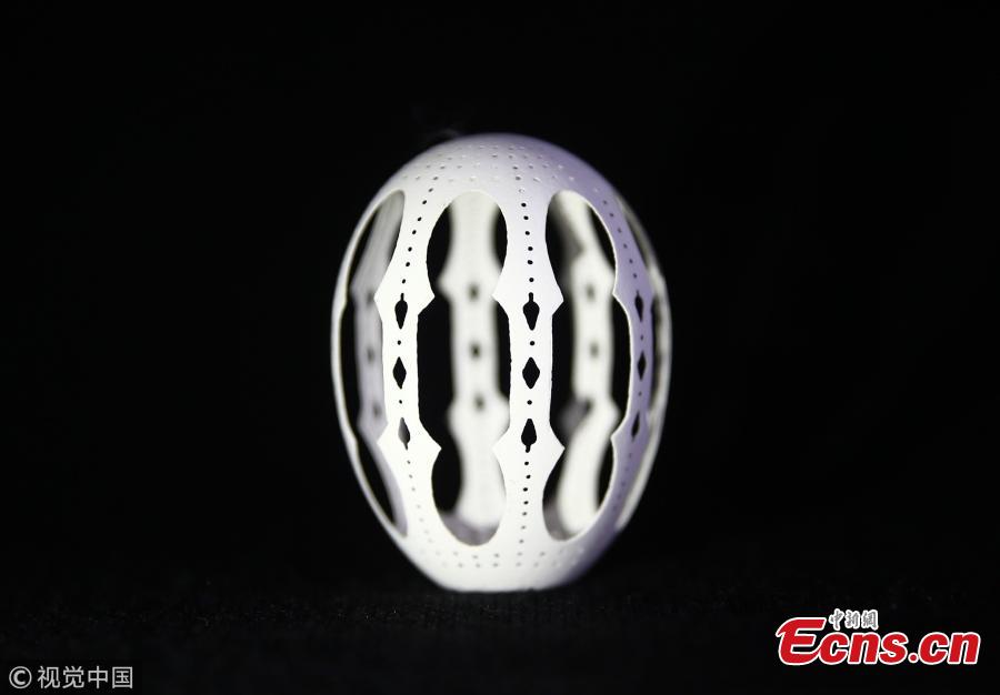 A chicken egg, carved by Naci Eroglu 60-year-old is seen at his workshop in Adana, Turkey on April 9, 2019. (Photo/VCG)