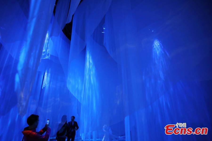 An interactive art installation project that draws inspiration from three famous paintings in Chinese history opens at a gallery in Deji Plaza, an upscale office and shopping mall complex in Nanjing, Jiangsu Province, April 11, 2019. Visitors appear to immerse themselves into scenes in the paintings. The three scrolls included \