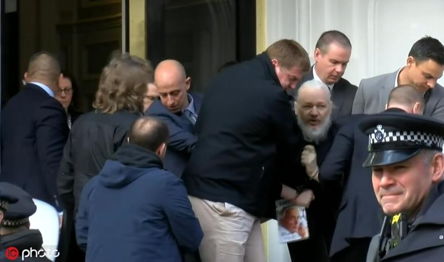 WikiLeaks founder Julian Assange is forcibly removed by British police from Ecuadorian embassy, April 11, 2019. British police dragged WikiLeaks founder Julian Assange out of Ecuador\'s embassy on Thursday after his seven-year asylum was revoked, paving the way for his extradition to the United States for one of the biggest ever leaks of classified information. (Photo/IC)