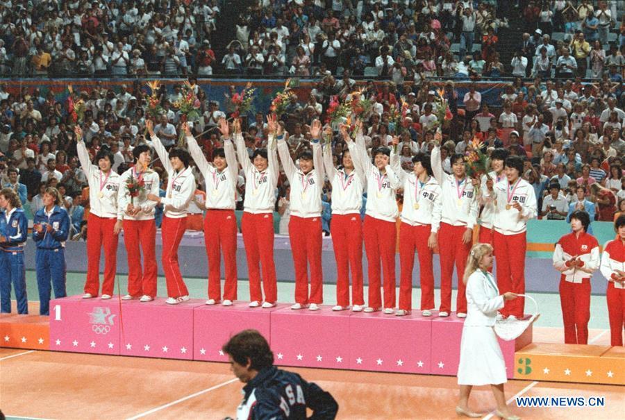 File photo taken on August 7, 1984 Chinese women\'s volleyball team celebrating on the podium during the awarding ceremony after winning the final against the United States at the 23rd Olympic Games in Los Angeles, the United States. From sending athletes to Helsinki Summer Olympic Games for the very first time in 1952 to winning the bid to host 2022 Winter Olympic Games in 2015, the People\'s Republic of China went through a remarkable history of sports, including successfully hosting the 2008 Summer Olympic Games and preparing for the upcoming 2022 Winter Olympic Games. (Xinhua/Hu Yue)