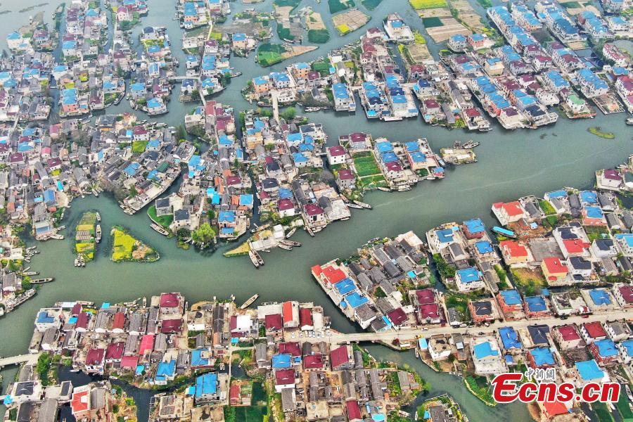 An aerial view of colorful fields crisscrossed by water in a rural area in Xinghua City, East China\'s Jiangsu Province, April 10, 2019. Locals have a tradition of digging mud from trenches or small rivers to form small plots of land. (Photo: China News Service/Yang Bo)