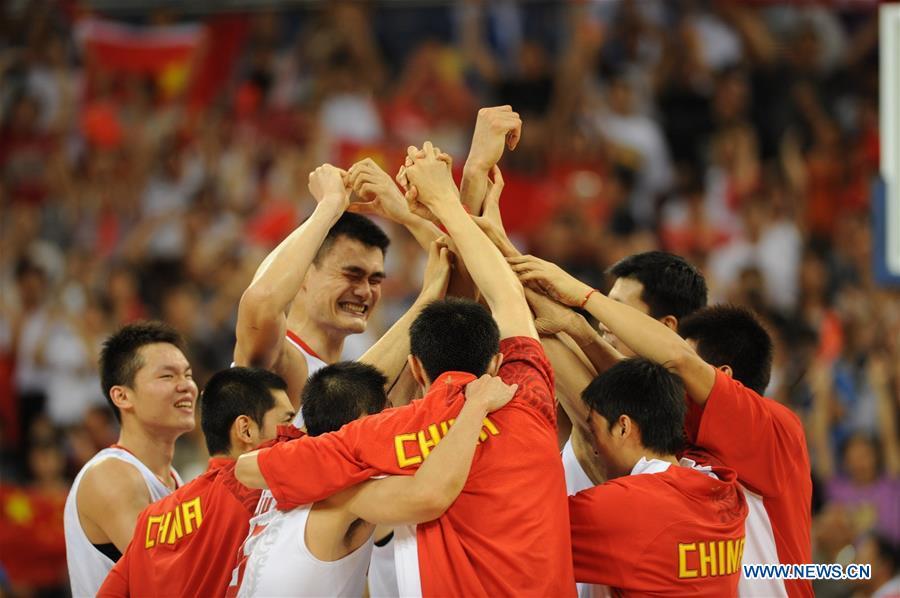 File photo taken on August 16, 2008 shows China\'s Yao Ming celebrates with teammates after winning the basketball match against Germany at 2008 Beijing Olympic Games. From sending athletes to Helsinki Summer Olympic Games for the very first time in 1952 to winning the bid to host 2022 Winter Olympic Games in 2015, the People\'s Republic of China went through a remarkable history of sports, including successfully hosting the 2008 Summer Olympic Games and preparing for the upcoming 2022 Winter Olympic Games. (Xinhua/Li Jundong)