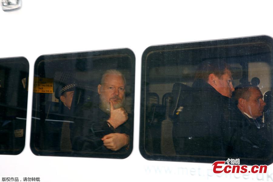 WikiLeaks founder Julian Assange arrives at the Westminster Magistrates Court, after he was arrested in London, Britain, April 11, 2019. British police dragged WikiLeaks founder Julian Assange out of Ecuador\'s embassy on Thursday after his seven-year asylum was revoked, paving the way for his extradition to the United States for one of the biggest ever leaks of classified information. (Photo/Agencies)