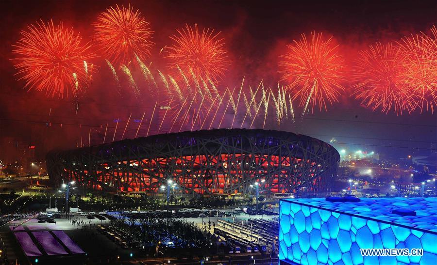 File photo taken on August 8, 2008 shows the fireworks displayed during the opening ceremony of the Beijing Olympic Games held in the National Stadium, also known as the Bird\'s Nest, in Beijing, capital of China. From sending athletes to Helsinki Summer Olympic Games for the very first time in 1952 to winning the bid to host 2022 Winter Olympic Games in 2015, the People\'s Republic of China went through a remarkable history of sports, including successfully hosting the 2008 Summer Olympic Games and preparing for the upcoming 2022 Winter Olympic Games. (Xinhua/Chen Kai)