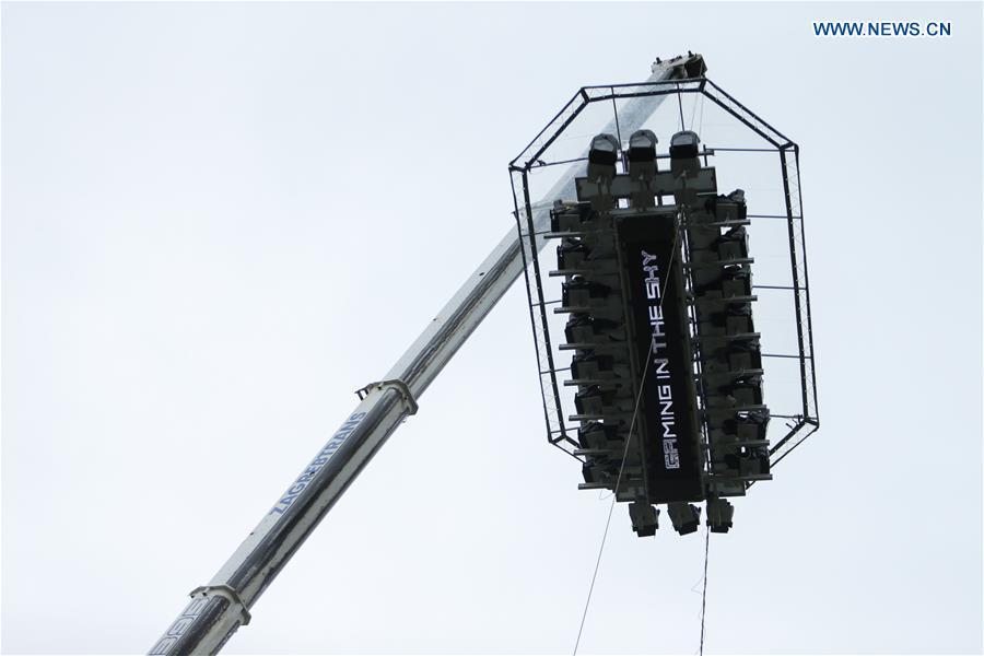 Gamers participate in Gaming in the Sky competition on a platform lifted by a crane in Zagreb, Croatia, April 13, 2019. (Xinhua/Filip Kos)