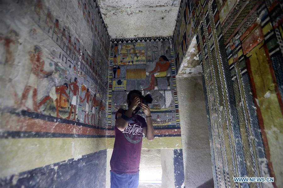 A man takes photos in a tomb in Saqqara, Egypt on April 13, 2019. Egyptian Ministry of Antiquities opened on Saturday a tomb of a Fifth Dynasty dignitary which was discovered recently at Saqqara Necropolis near the Giza pyramids. Minister of Antiquities Khaled al-Anany, along with 52 ambassadors and cultural attaches of foreign, Arab and African countries, toured Saqqara Necropolis to inspect the tomb of Khuwy, who lived at the end of the Fifth Dynasty of the Old Kingdom. The Old Kingdom of Egypt is the period spanning 2686 BC to 2181 BC, which is also known as the Age of the Pyramids. (Xinhua/Ahmed Gomaa)