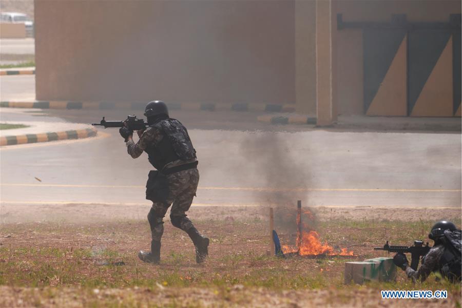 Soldiers of the Jordan Armed Forces (JAF) perform an anti-terror drill on the opening ceremony of the 11th annual Warrior Competition at the King Abdullah II Special Operations Training Center (KASOTC) in Amman, Jordan, April 14, 2019. (Xinhua/Lin Xiaowei)