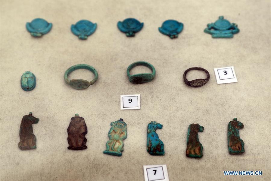 Photo taken on April 13, 2019 shows the unearthed artifacts in a tomb in Saqqara, Egypt. Egyptian Ministry of Antiquities opened on Saturday a tomb of a Fifth Dynasty dignitary which was discovered recently at Saqqara Necropolis near the Giza pyramids. Minister of Antiquities Khaled al-Anany, along with 52 ambassadors and cultural attaches of foreign, Arab and African countries, toured Saqqara Necropolis to inspect the tomb of Khuwy, who lived at the end of the Fifth Dynasty of the Old Kingdom. The Old Kingdom of Egypt is the period spanning 2686 BC to 2181 BC, which is also known as the Age of the Pyramids. (Xinhua/Ahmed Gomaa)