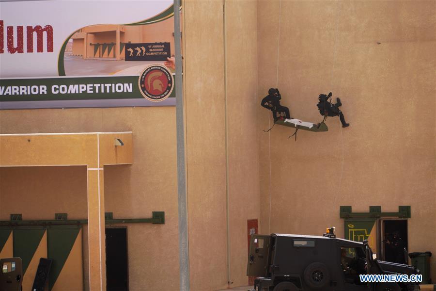 Soldiers of the Jordan Armed Forces (JAF) perform an anti-terror drill on the opening ceremony of the 11th annual Warrior Competition at the King Abdullah II Special Operations Training Center (KASOTC) in Amman, Jordan, April 14, 2019. (Xinhua/Lin Xiaowei)