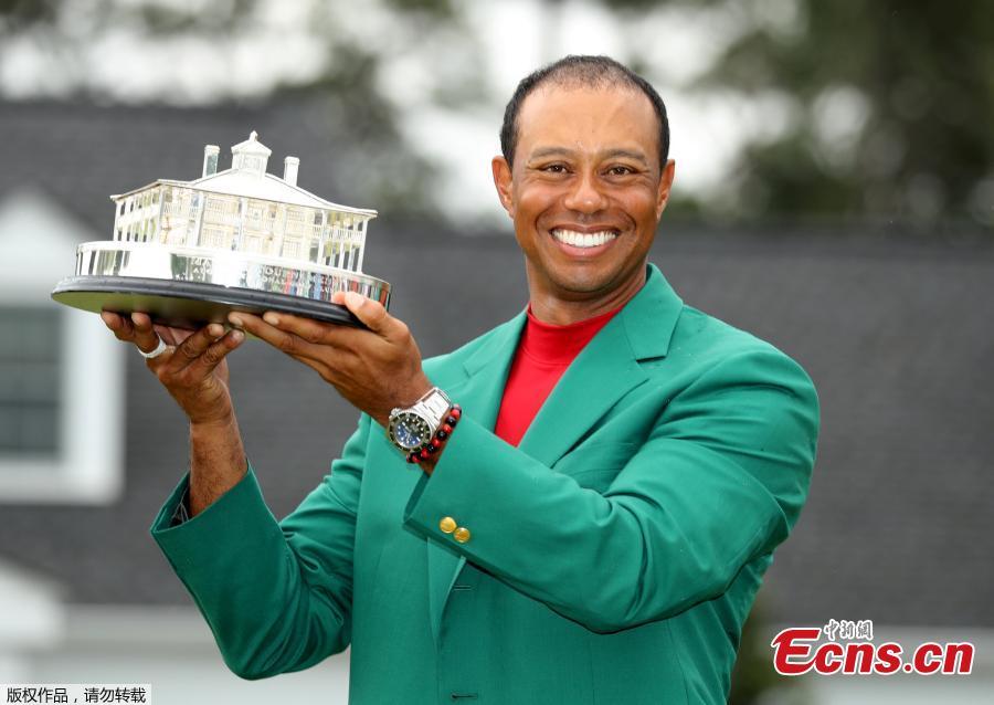 Tiger Woods celebrates with his fifth green jacket after winning the 2019 Masters Tournament at the Augusta National Golf Club in Augusta, Georgia, on April 14, 2019. (Photo/Agencies)