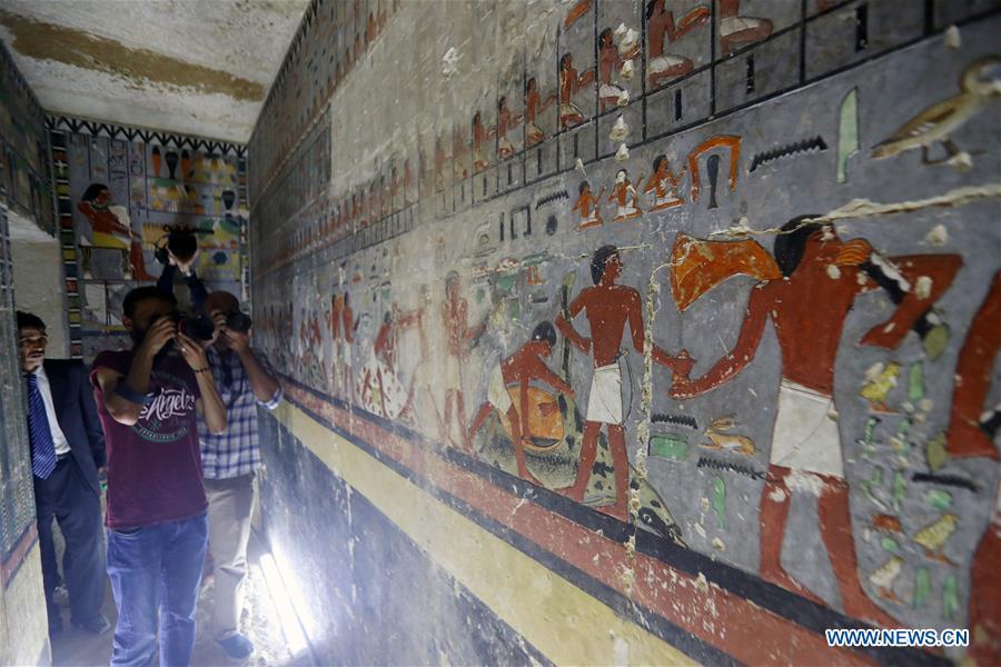 People visit a tomb in Saqqara, Egypt on April 13, 2019. Egyptian Ministry of Antiquities opened on Saturday a tomb of a Fifth Dynasty dignitary which was discovered recently at Saqqara Necropolis near the Giza pyramids. Minister of Antiquities Khaled al-Anany, along with 52 ambassadors and cultural attaches of foreign, Arab and African countries, toured Saqqara Necropolis to inspect the tomb of Khuwy, who lived at the end of the Fifth Dynasty of the Old Kingdom. The Old Kingdom of Egypt is the period spanning 2686 BC to 2181 BC, which is also known as the Age of the Pyramids. (Xinhua/Ahmed Gomaa)