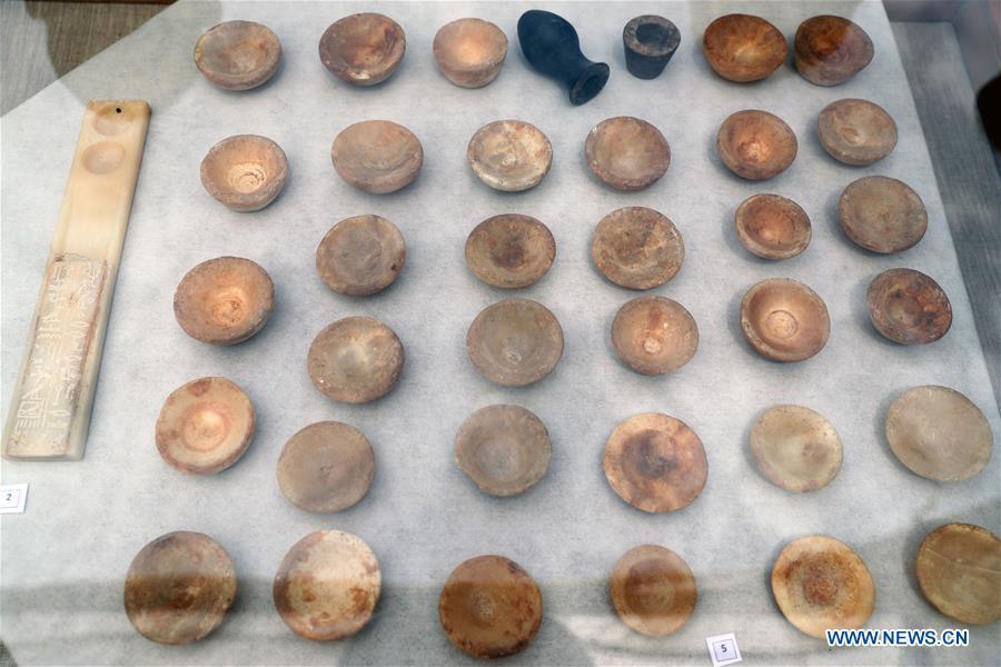 Photo taken on April 13, 2019 shows the unearthed artifacts in a tomb in Saqqara, Egypt. Egyptian Ministry of Antiquities opened on Saturday a tomb of a Fifth Dynasty dignitary which was discovered recently at Saqqara Necropolis near the Giza pyramids. Minister of Antiquities Khaled al-Anany, along with 52 ambassadors and cultural attaches of foreign, Arab and African countries, toured Saqqara Necropolis to inspect the tomb of Khuwy, who lived at the end of the Fifth Dynasty of the Old Kingdom. The Old Kingdom of Egypt is the period spanning 2686 BC to 2181 BC, which is also known as the Age of the Pyramids. (Xinhua/Ahmed Gomaa)