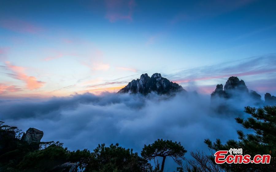 Clouds surround Mount Sanqing in Jiangxi Province. Mount Sanqing National Park is a UNESCO world heritage site, known for its exceptional scenic quality, marked by a concentration of fantastically shaped pillars and peaks. (Photo: China News Service/Zheng Xiaiping)