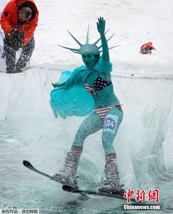 A costumed skier attempts to cross a pool of water at the foot of a ski slope during the annual Gornoluzhnik amateur event to mark the end of the ski season at the Bobrovy Log ski resort in Krasnoyarsk, Russia, April 14, 2019. (Photo/Agencies)