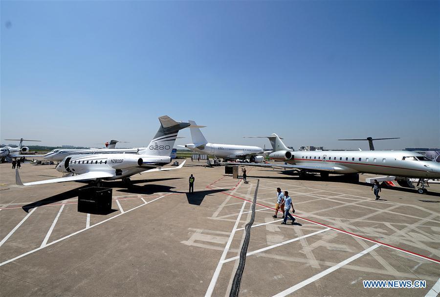 Business aircrafts are parked on the tarmac for the upcoming 2019 Asian Business Aviation Conference & Exhibition at Shanghai Hongqiao International Airport in east China\'s Shanghai, April 15, 2019. The 2019 Asian Business Aviation Conference & Exhibition (ABACE) will be held from April 16 to 18 at a business aviation service center of Shanghai Hongqiao International Airport. The event is participated by about 150 global exhibitors showcasing more than 30 aircrafts. (Xinhua/Chen Fei)